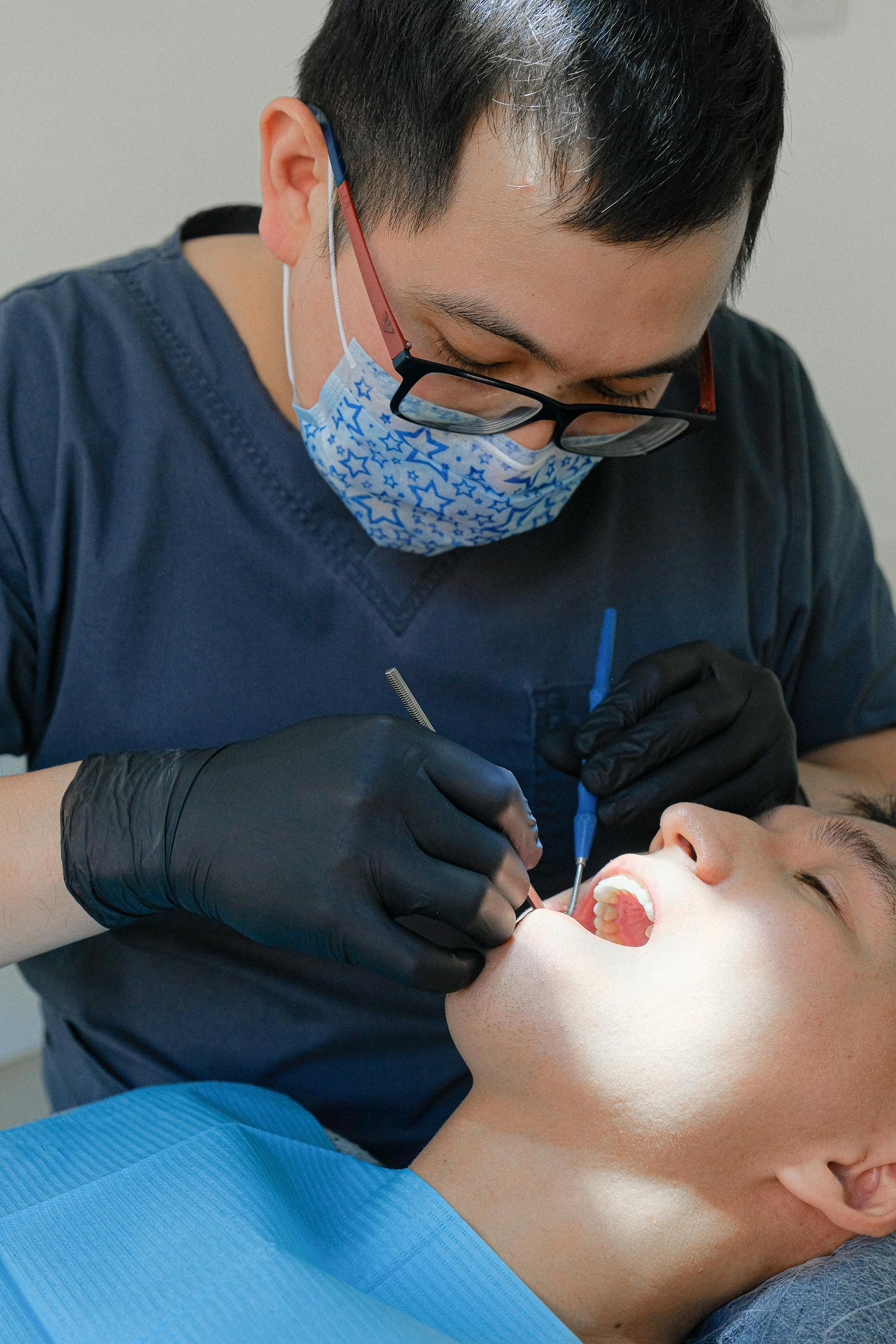 Dentist and patient during a dental check-up, preventive care